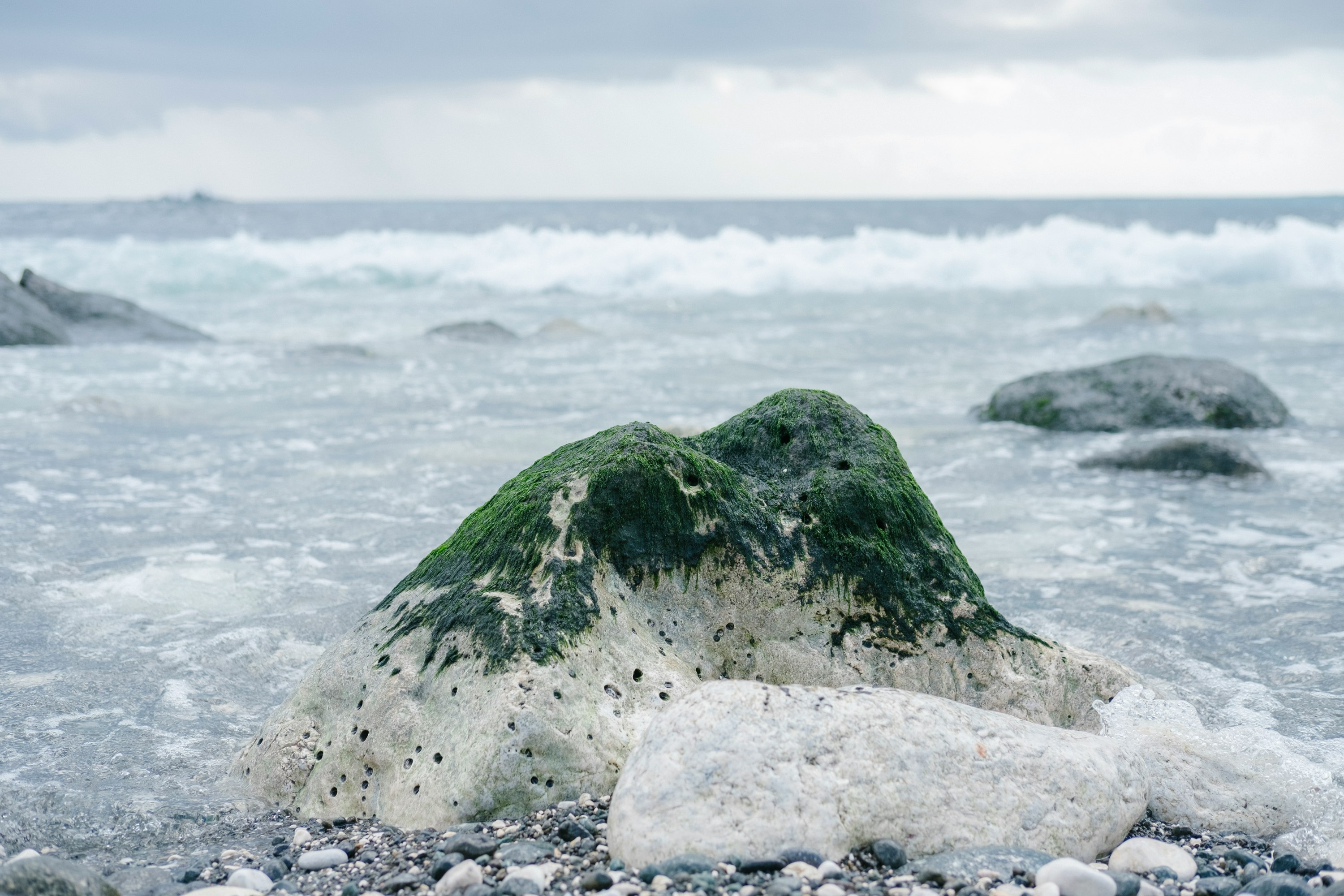 green rock on water